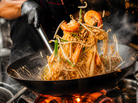 Authentic Thai Street Food Preparation, Chef Cooking Pad Thai in Wok, Tom Yum Soup, Som Tum Papaya Salad, Khao Soi, and Mango Sticky Rice