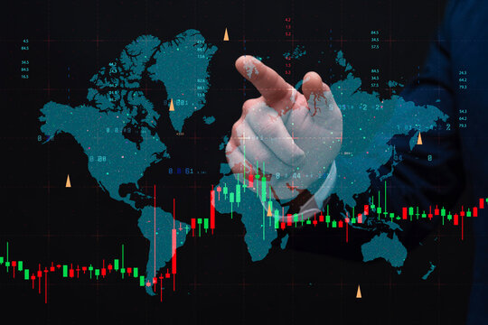 Businessman touching digital world map with global stock market candlestick charts and financial data overlays. International finance, investment, trading, economic analysis and global market concept.