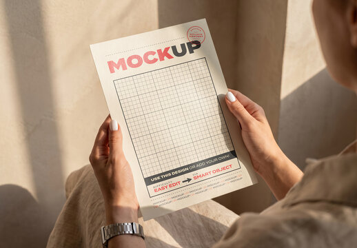 Person Holding Page Flyer Mockup