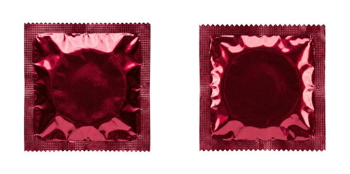 Two red foil condom wrappers isolated on transparent background