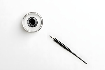 Fototapeta premium A overhead photo of an ink well and an ink pen, shot from above on a white background with copy space