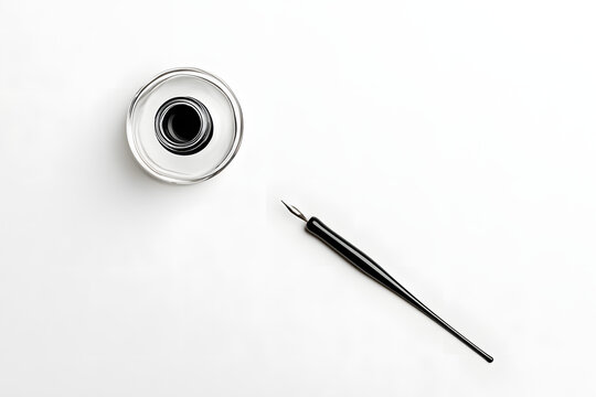 A overhead photo of an ink well and an ink pen, shot from above on a white background with copy space