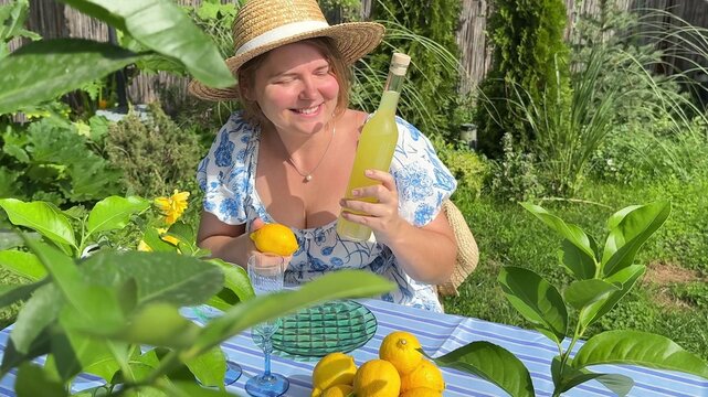 A young woman smiling warmly while sitting outdoors near tropical foliage, enjoying a refreshing moment of relaxation, conveying pure summer happiness and natural beauty