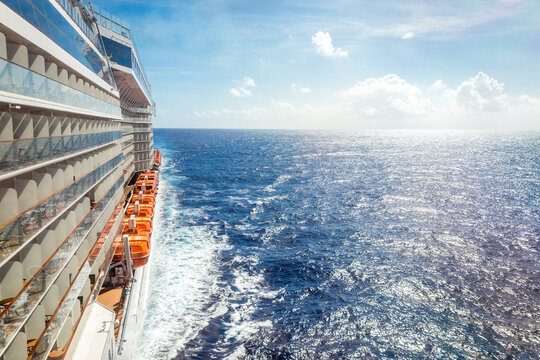 Ocean view from a cruise ship deck on a bright day