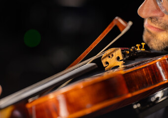 Violinist Playing Violin on Black Background © Lukas Gojda