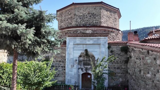 Historic Ottoman Yildirim Beyazit Bathhouse Entrance with Carved Marble Portal and Octagonal Stone Structure in Mudurnu