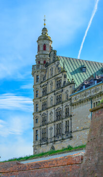Helsing?r, Denmark - June 30 2026: Renaissance Kronborg Castle facade rising behind brick fortification walls.