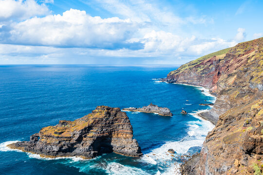 Scenic view of the volcanic cliffs and the Roque de Santo Domingo sea stack on the rugged north coast of La Palma, Canary Islands, Spain