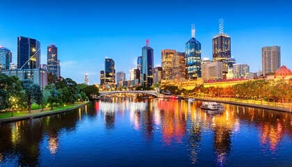 Fototapeta premium vibrant night cityscape of melbourne skyline reflecting in yarra river