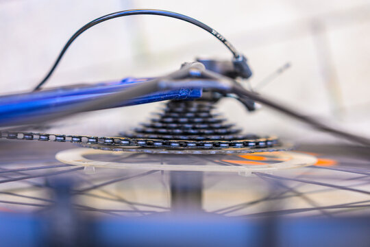Bicycle rear cassette chain and wheel in closeup.