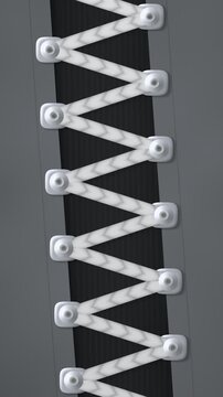 Braided Lace Cord Slipping Through Metal Eyelet Plates in Stepped Jumps Seamless Loop in vibrant graphite tones vertical 9:16