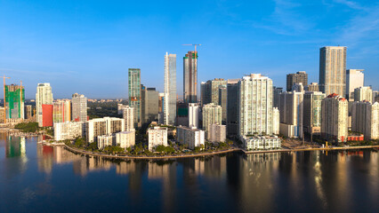 Naklejka premium Aerial sunrise view of Miami skyline across Biscayne Bay