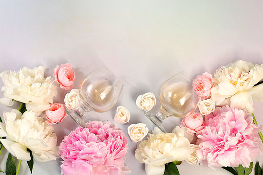 Banner with different types of rose wine, whiskey, summer alcoholic cocktail for a party and peonies on a light background, bar and cafe concept, advertising still life for an invitation,