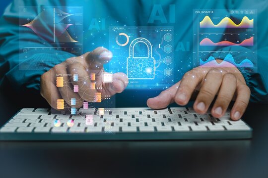 Hand taps keyboard as holograms float above. Data streams, graphs, and locks glow around the hand. Blue digital overlays suggest security and analysis