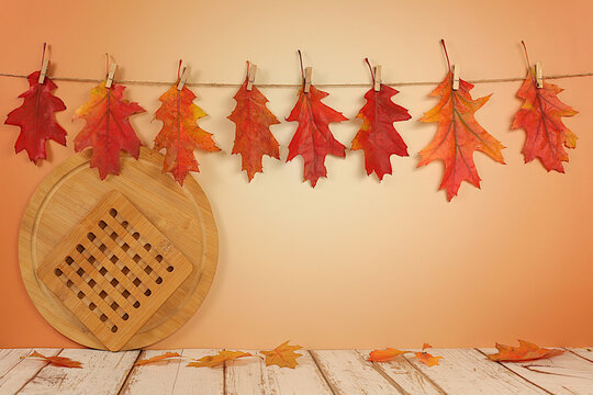 Autumn abstract composition with maple leaves in a vase on an elegant modern kitchen table, still life and Thanksgiving concept, seasonal background and banner for screen, greeting card..