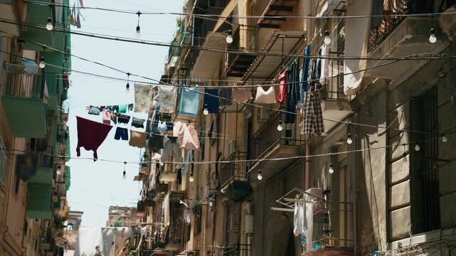 A typical Naples street with laundry hanging on lines strung between buildings