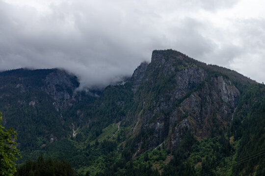 Misty Mountain Ridge Over Forested Valley Near Yale, BC Canada Under Heavy Cloud Cover