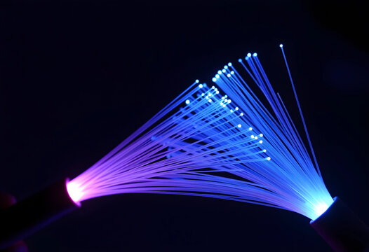 Fiber optic cables with glowing blue and purple light on a dark background data transmission and modern technology, this image high speed internet telecommunication networks and digital