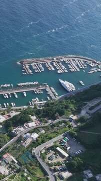 Aerial Establishing View of Capri Island Port and Mediterranean Sea