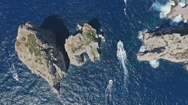 Aerial View of Tourist Boats Sailing by Faraglioni Rock Capri Italy