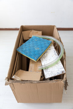 A box of construction waste indoors