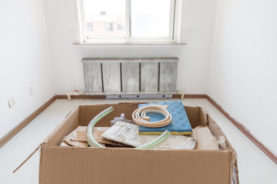 A box of construction waste indoors