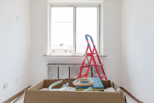A box of construction waste indoors
