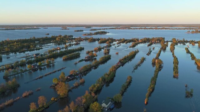 Picturesque aerial perspective of the unique scheendijk peat islands near breukelen, netherlands, showing houses and trees on long strips of land