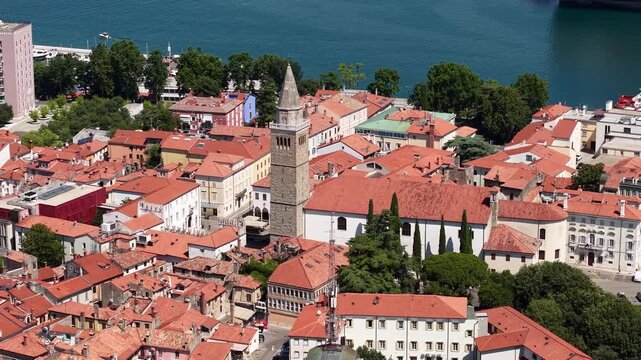 Drone Shot of Catholic Cathedral Bell Tower in Old Town of Koper, Slovenia on Hot Summer Day