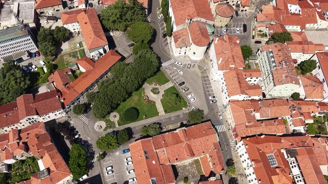 Koper, Slovenia. Revealing Drone Shot of Old Town Buildings by Adriatic Sea on Hot Sunny Day
