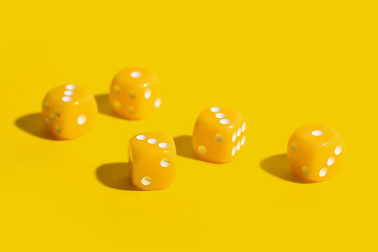 Game dices on yellow background