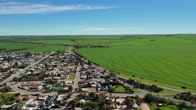 Port Clinton, Yorke Peninsula, South Australia &ndash; 4K aerial drone view of tidal beach, tidal flats, coastal township, holiday homes, residential estates, Gulf St Vincent shoreline, farmland, wetland.