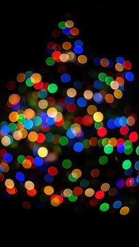 Christmas tree light bokeh colorful holiday decoration abstract dark background christmas tree light bokeh colorful holiday decoration abstract dark background glowing circle Christmas Concept