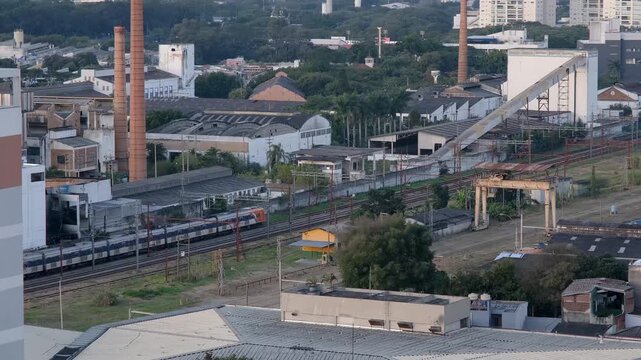 A train passing between old factories and warehouses in the Lapa neighborhood of Sao Paulo.