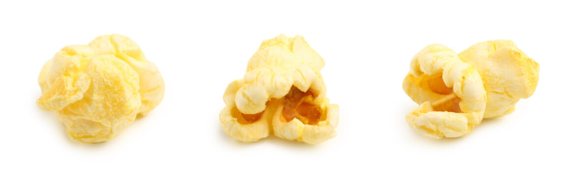Three fluffy yellow popcorn kernels, movie snack and entertainment food, isolated on a clean white background