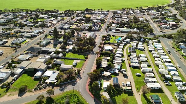 Port Clinton, Yorke Peninsula, South Australia &ndash; 4K aerial drone view of tidal beach, tidal flats, coastal township, holiday homes, residential estates, Gulf St Vincent shoreline, farmland, wetland.