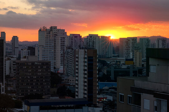 Sunset between buildings in the Lapa neighborhood.