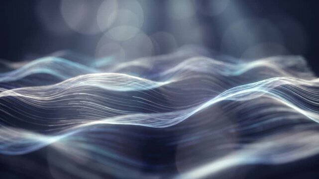 深いインディゴブルーの空間でプラチナと水色の発光粒子が砂丘のようにうねる量子砂漠。美しいボケ味を持つ抽象的なマクロ映像。