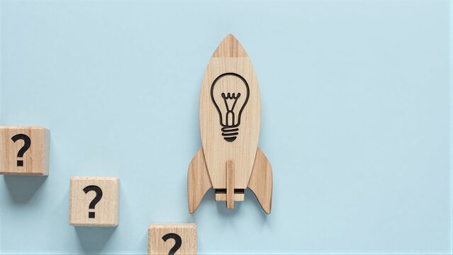 Wooden rocket with lightbulb symbol, surrounded by question mark blocks.