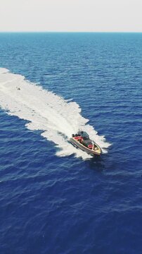 Aerial View Fast Speedboat and Jet Ski on Clear Blue Greek Sea