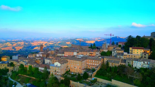 SANTA VITTORIA IN MATENANO, ITALY - OCTOBER 10, 2025: Aerial truck left shot of the town centre. Perched 626 mt above sea level on a lush Fermo hilltop, the historic center offers a peaceful escape