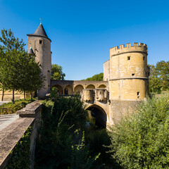 Obraz premium Porte des Allemands, a fortified bridge, standing under a clear blue sky in Metz