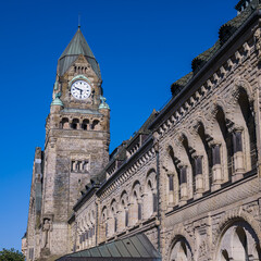 Fototapeta premium Historic Neo Romanesque architecture of the Metz train station against a clear blue sky