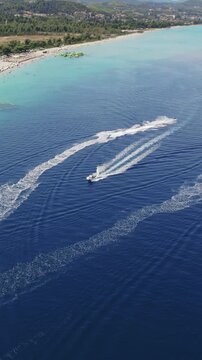 Aerial View of Boat and Scooter Recreation at Glarokavos Beach Halkidiki