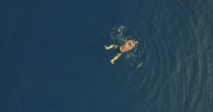 Top Down View Man Swimming in Clear Blue Sea Water in Chalkidiki