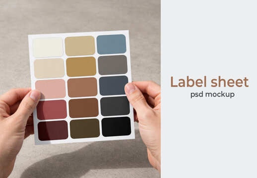 Hands Holding Label Sheet Mockup PSD With Color Swatches On Neutral Background