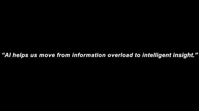 Text quote about artificial intelligence helping to move from information overload to intelligent insight is displayed on a black background.