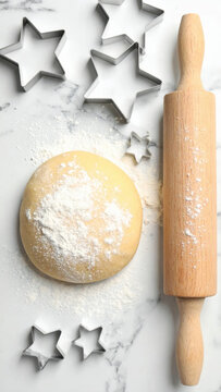 Baking dough marble countertop rolling pin star cookie cutter holiday baking flour dust kitchen utensil festive cookie homemade pastry winter season baking dough rests marble Christmas Concept