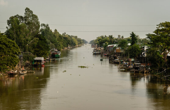 poor shoddy houses and boats on a river