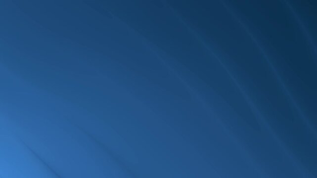 Gradient blue background with soft light beams is suitable for artistic projects, presentations, invitations, posters, and elegant designs. Calm and elegant texture.